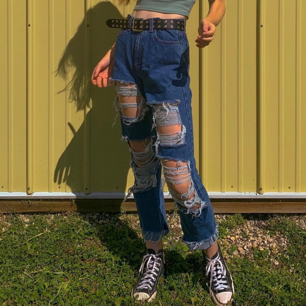 distressed ripped blue jeans